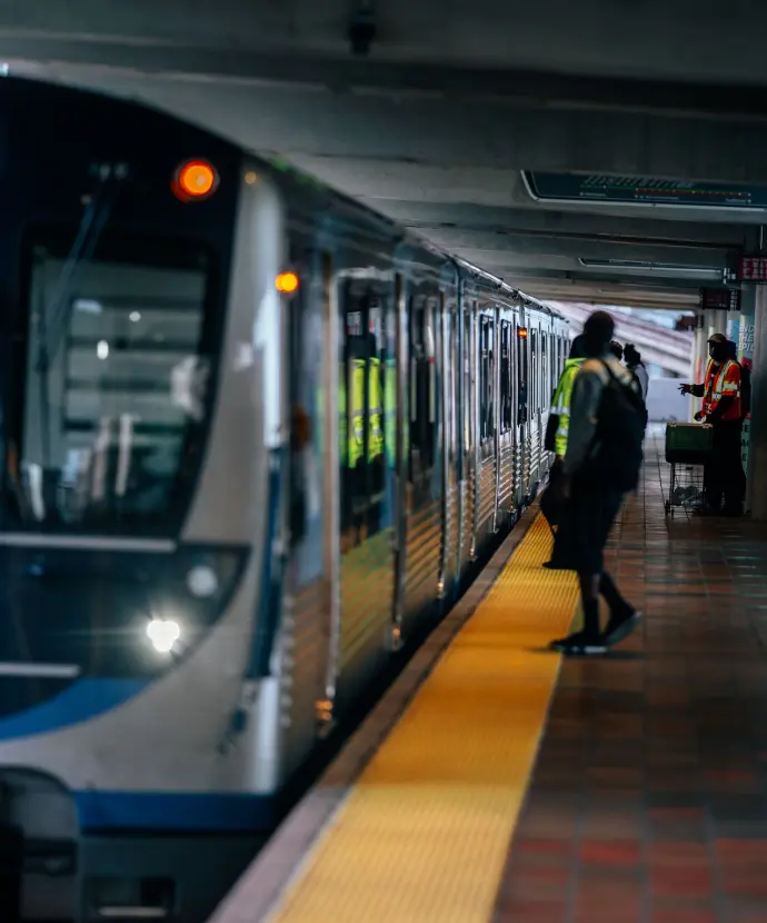 Metro train at station with passengers boarding